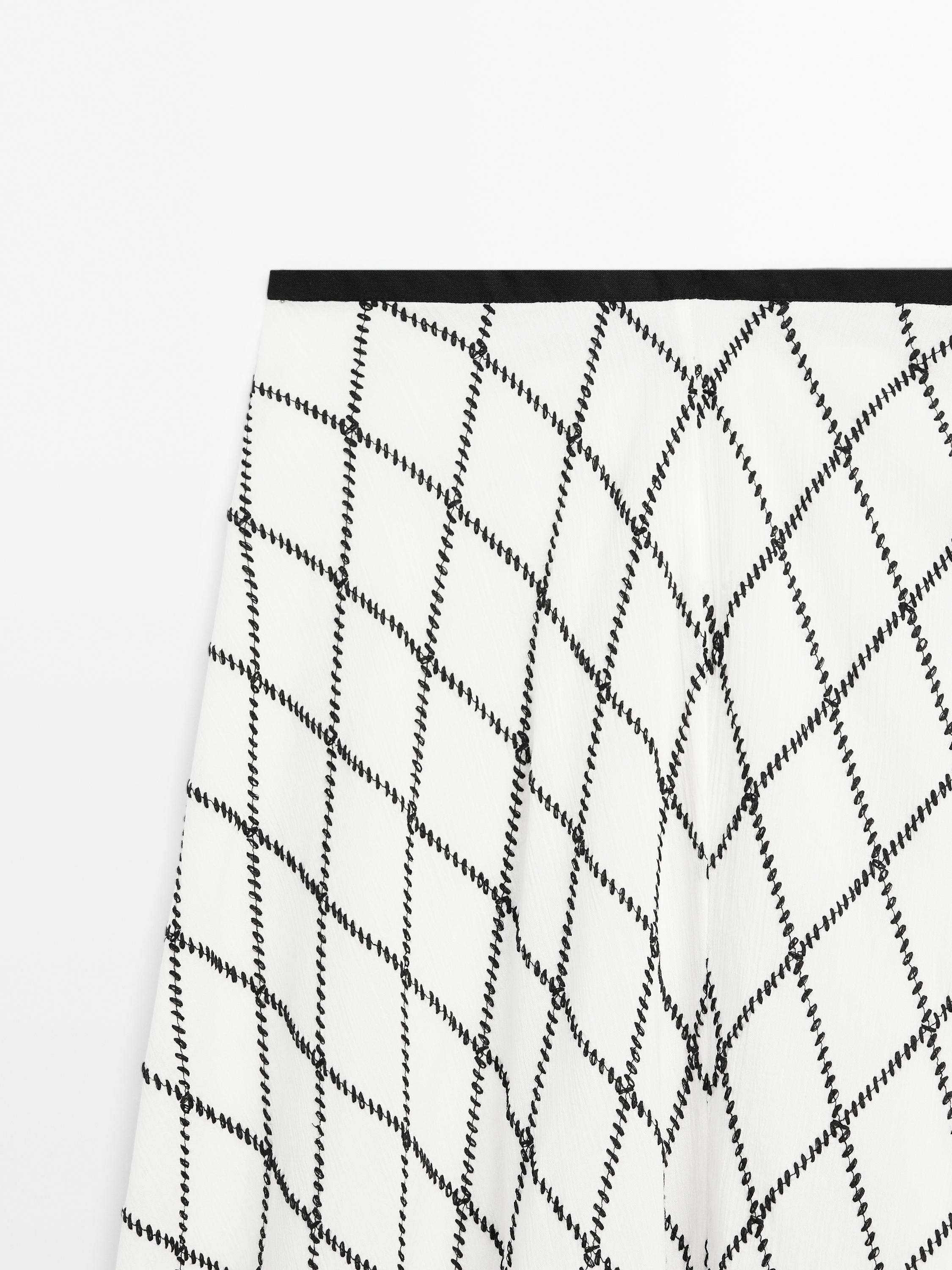 Jupe midi ample évasée à carreaux